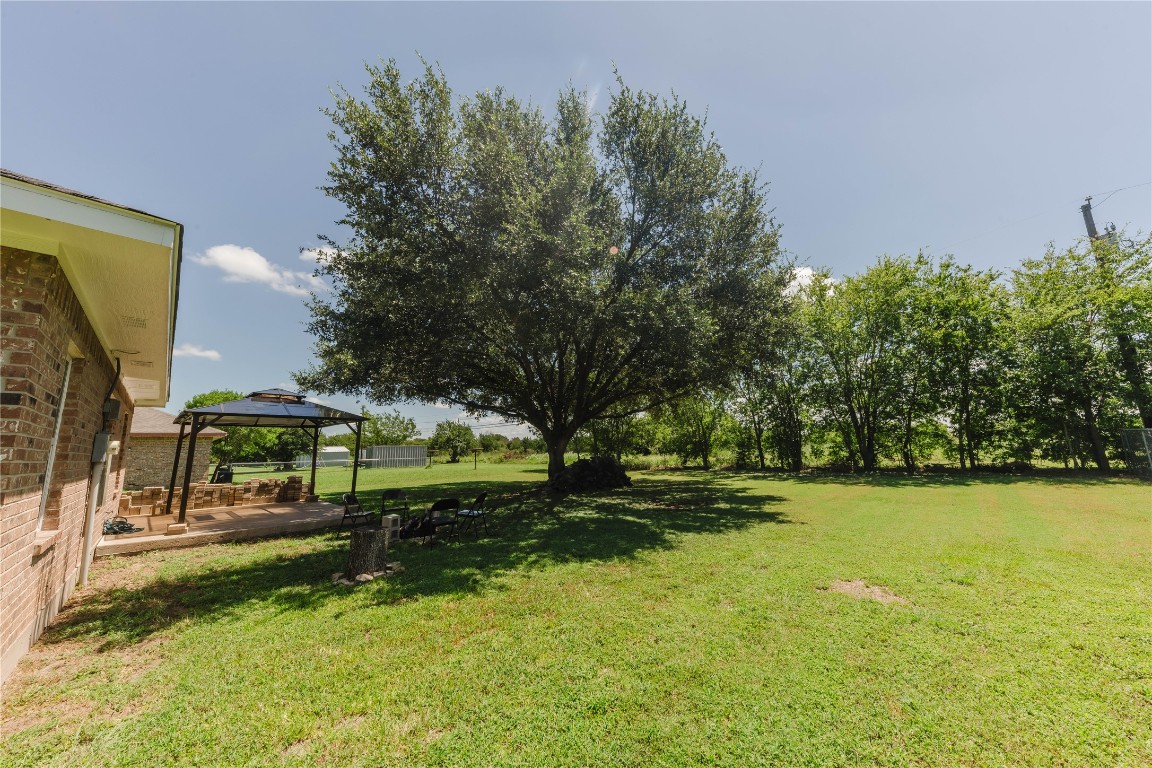 107 Silver Fox Waco, TX 76705 - Photo 31 of 33 a view of swimming pool with lawn chairs and large trees