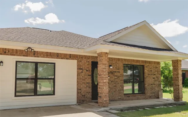 a front view of a house with a porch