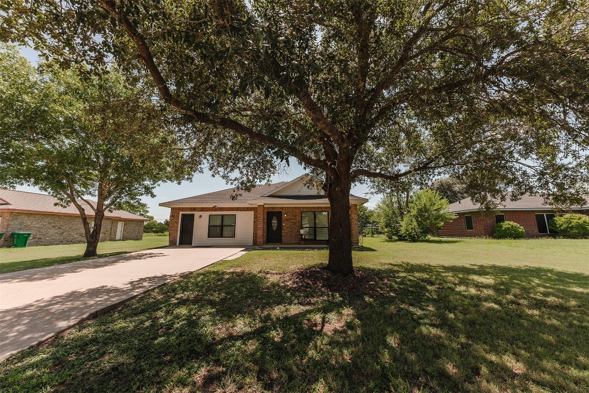 107 Silver Fox Waco, TX 76705 - Photo 8 of 33 a front view of a house with a yard
