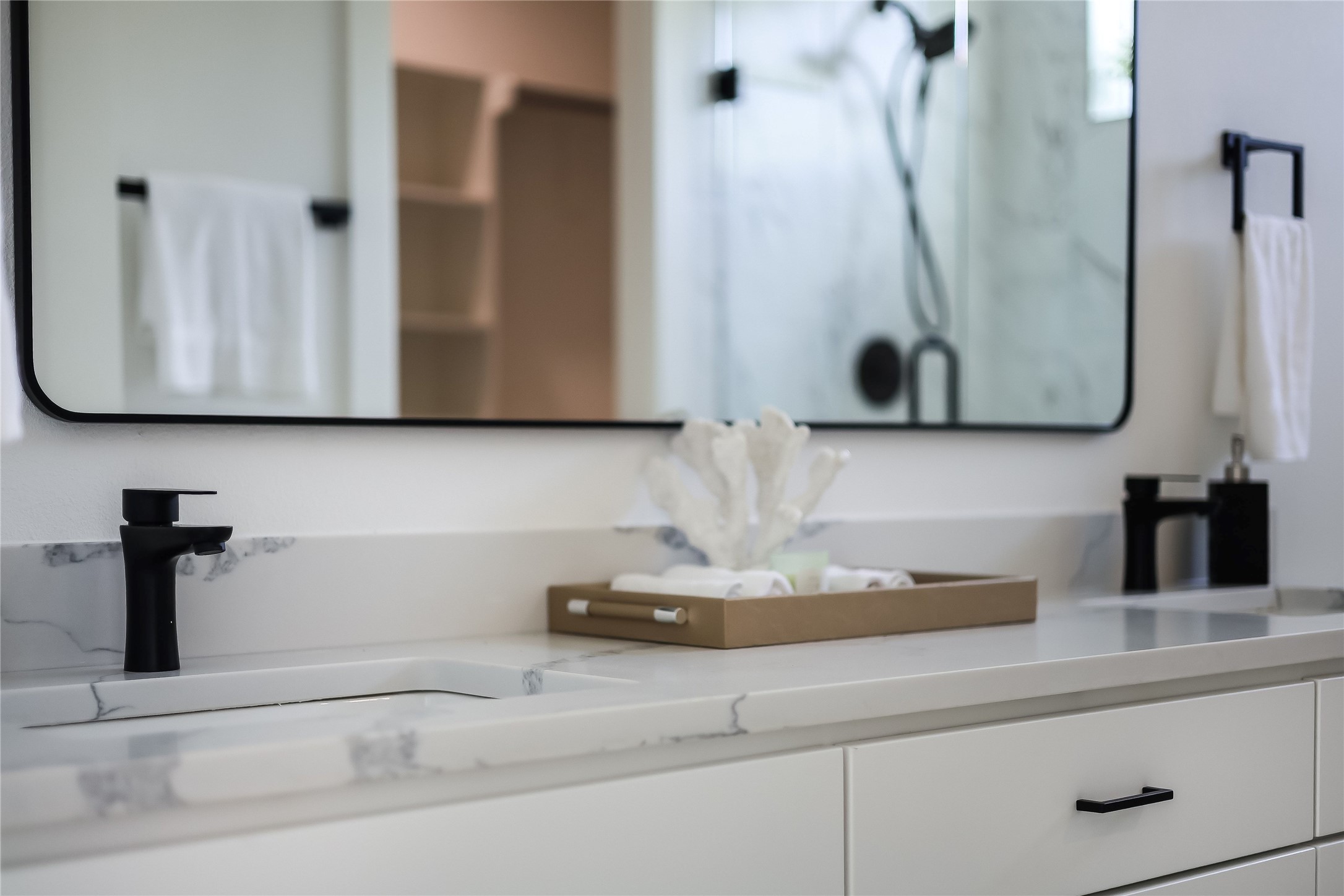 6809 Porter Street, Unit 1 Austin, TX 78741 - Photo 26 of 40 Refined primary bathroom featuring dual sinks set in sleek quartz counters.