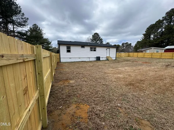 a house view with a garden space