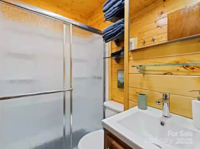 a bathroom with a sink and mirror