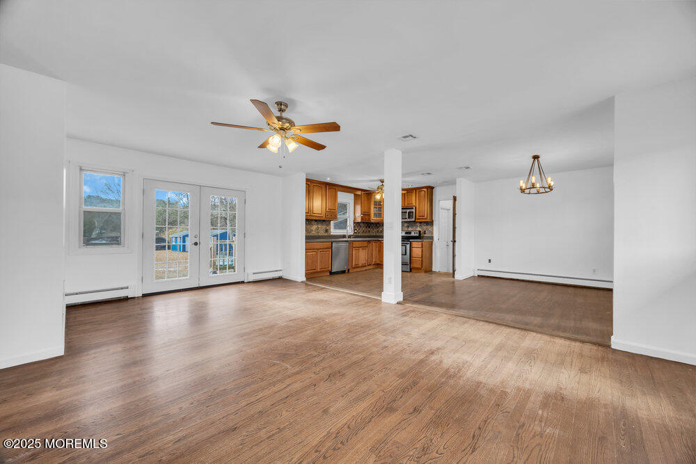Undisclosed Address New Egypt, NJ 08533 - Photo 4 of 28 a view of an empty room with a window and wooden floor