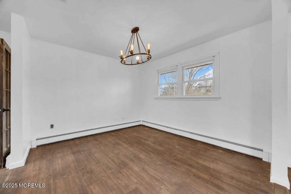 Undisclosed Address New Egypt, NJ 08533 - Photo 6 of 28 an empty room with wooden floor and windows