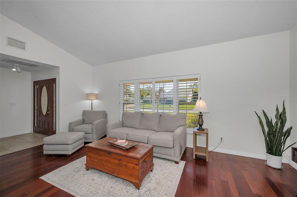 2949 Glenpark Road Palm Harbor, FL 34683 - Photo 11 of 60 a living room with furniture rug and window