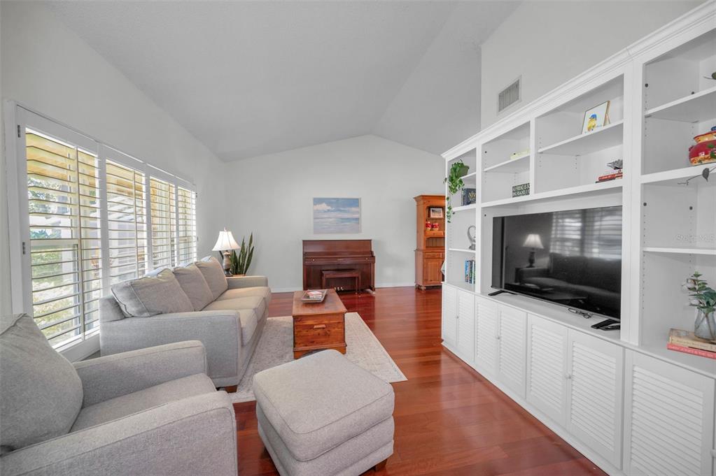 2949 Glenpark Road Palm Harbor, FL 34683 - Photo 12 of 60 a living room with furniture and a flat screen tv