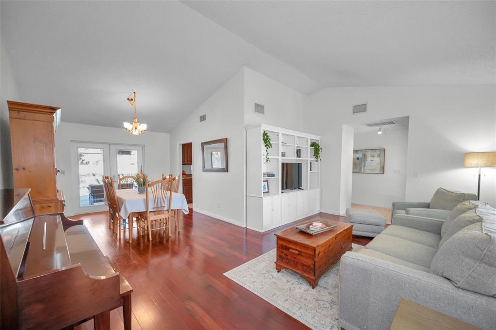 2949 Glenpark Road Palm Harbor, FL 34683 - Photo 13 of 60 a living room with furniture or wooden floor and a lamp