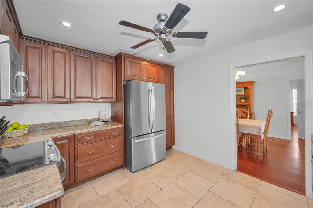 2949 Glenpark Road Palm Harbor, FL 34683 - Photo 20 of 60 a kitchen with stainless steel appliances granite countertop a refrigerator and a sink