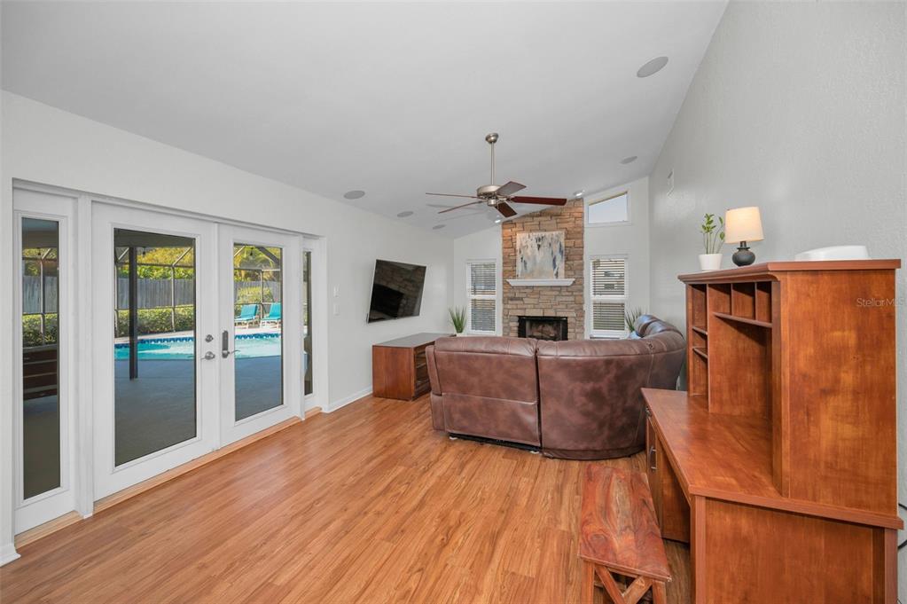 2949 Glenpark Road Palm Harbor, FL 34683 - Photo 25 of 60 a living room with furniture and a fireplace