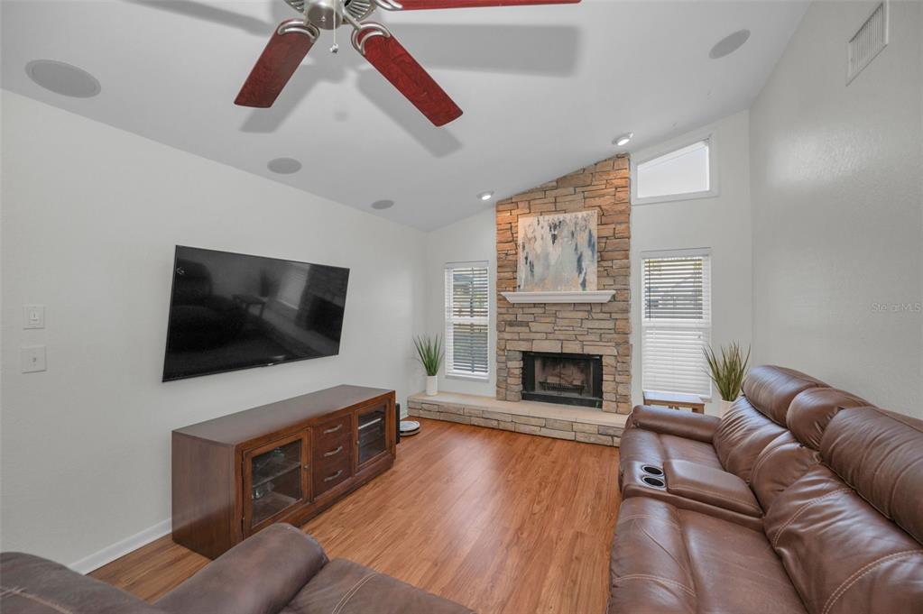 2949 Glenpark Road Palm Harbor, FL 34683 - Photo 26 of 60 a living room with furniture and a flat screen tv