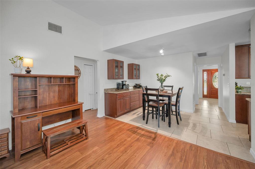 2949 Glenpark Road Palm Harbor, FL 34683 - Photo 29 of 60 a dining room with furniture and wooden floor