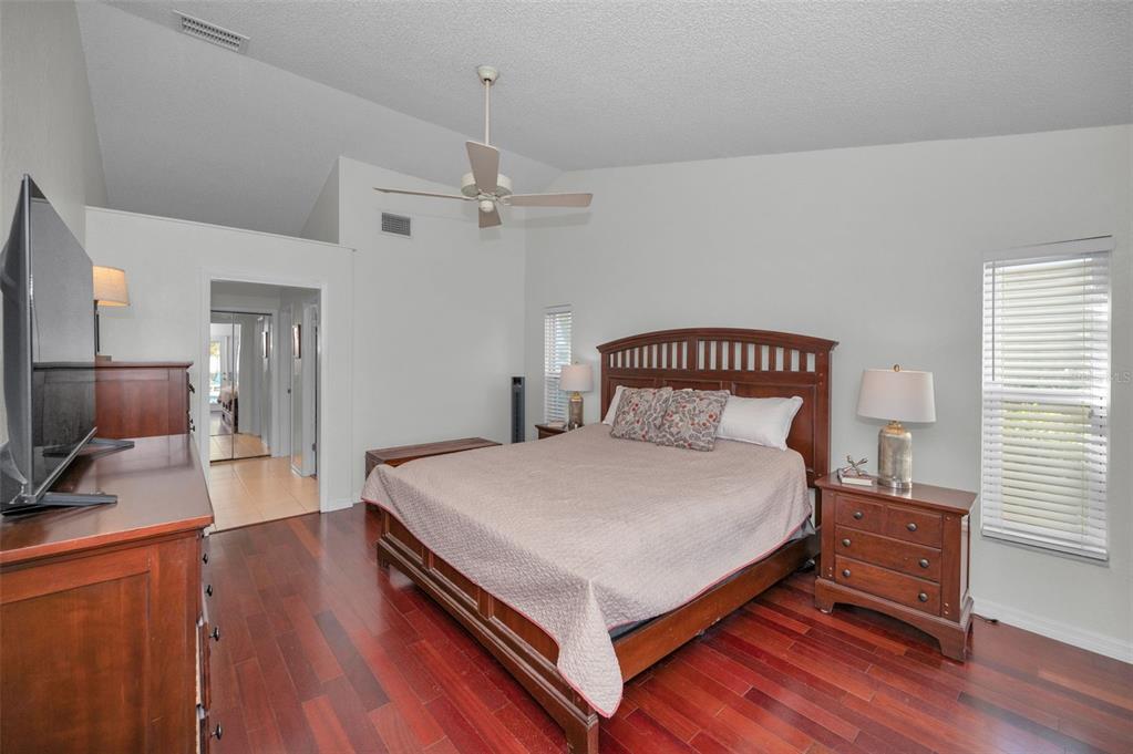 2949 Glenpark Road Palm Harbor, FL 34683 - Photo 31 of 60 a bedroom with a bed and a flat screen tv