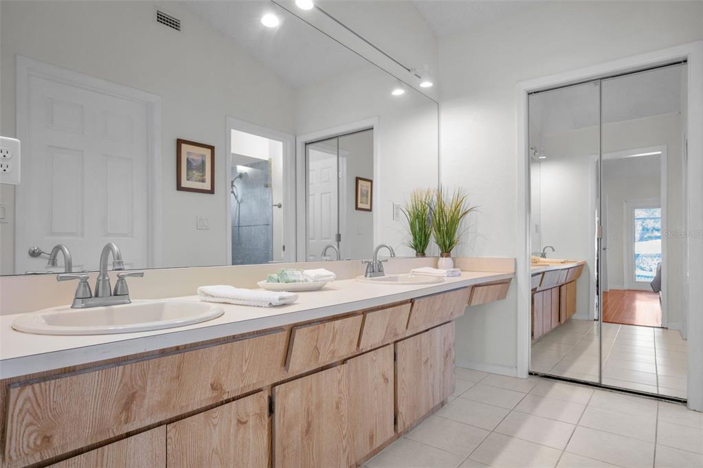 2949 Glenpark Road Palm Harbor, FL 34683 - Photo 33 of 60 a bathroom with a sink and a mirror