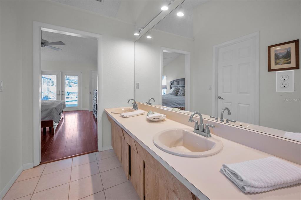 2949 Glenpark Road Palm Harbor, FL 34683 - Photo 35 of 60 a bathroom with a sink and a mirror