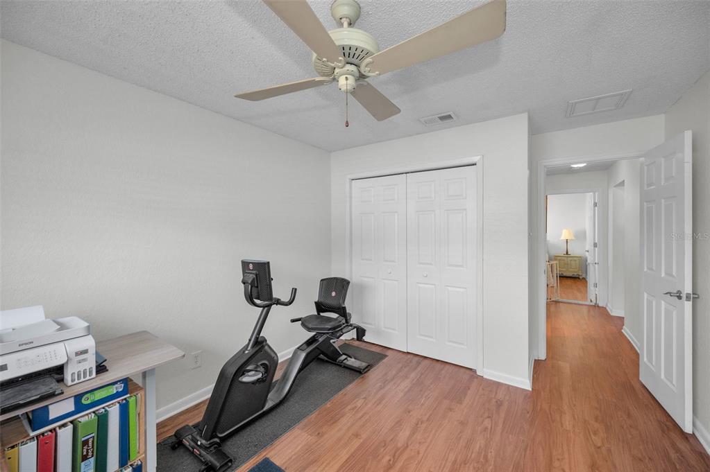 2949 Glenpark Road Palm Harbor, FL 34683 - Photo 41 of 60 a view of a workspace with furniture and wooden floor