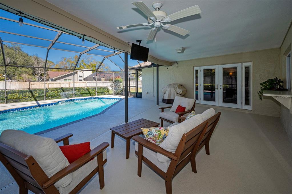 2949 Glenpark Road Palm Harbor, FL 34683 - Photo 47 of 60 a living room with furniture and a floor to ceiling window