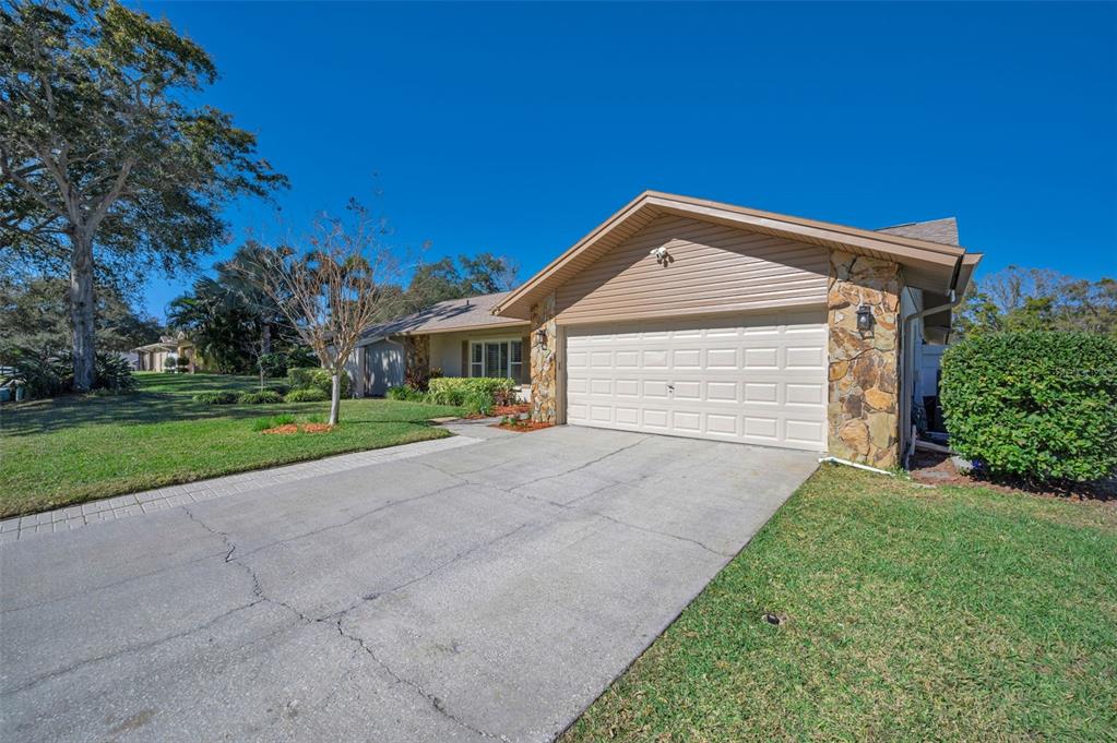 2949 Glenpark Road Palm Harbor, FL 34683 - Photo 5 of 60 a front view of a house with a yard