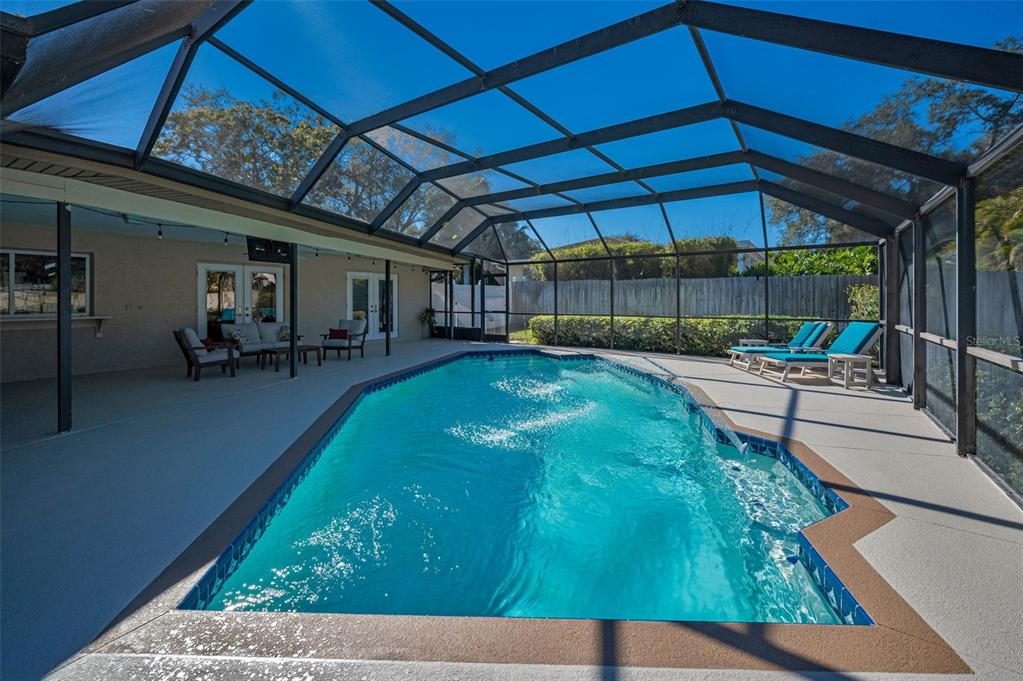 2949 Glenpark Road Palm Harbor, FL 34683 - Photo 51 of 60 a swimming pool with outdoor seating and yard