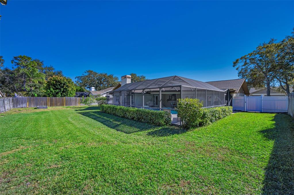 2949 Glenpark Road Palm Harbor, FL 34683 - Photo 54 of 60 a view of a house with a yard