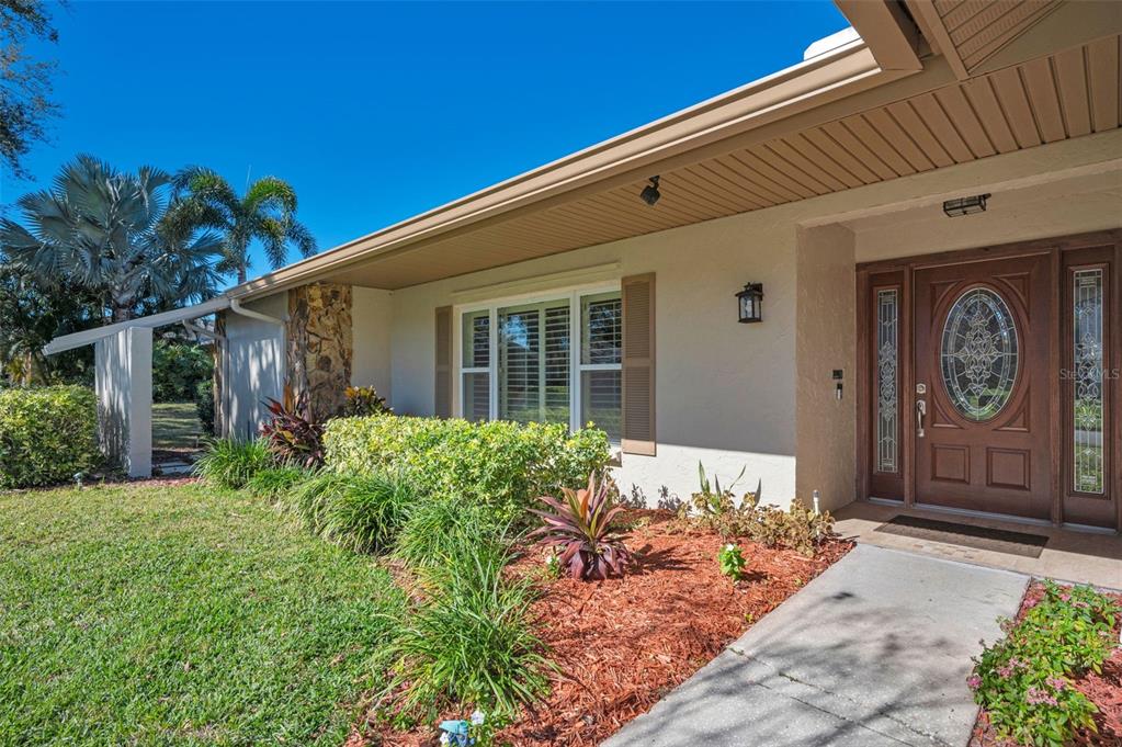 2949 Glenpark Road Palm Harbor, FL 34683 - Photo 8 of 60 a front view of house with yard