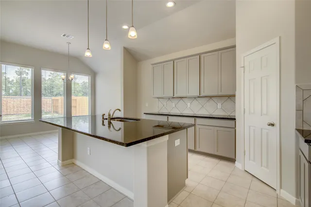 a bathroom with a sink toilet and a mirror