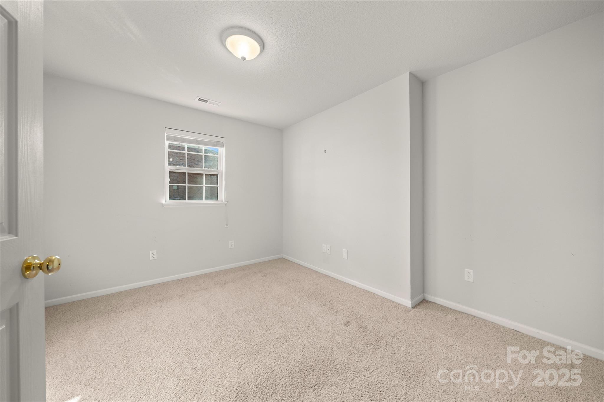 270 Farington Circle Fletcher, NC 28732 - Photo 16 of 29 an empty room with windows
