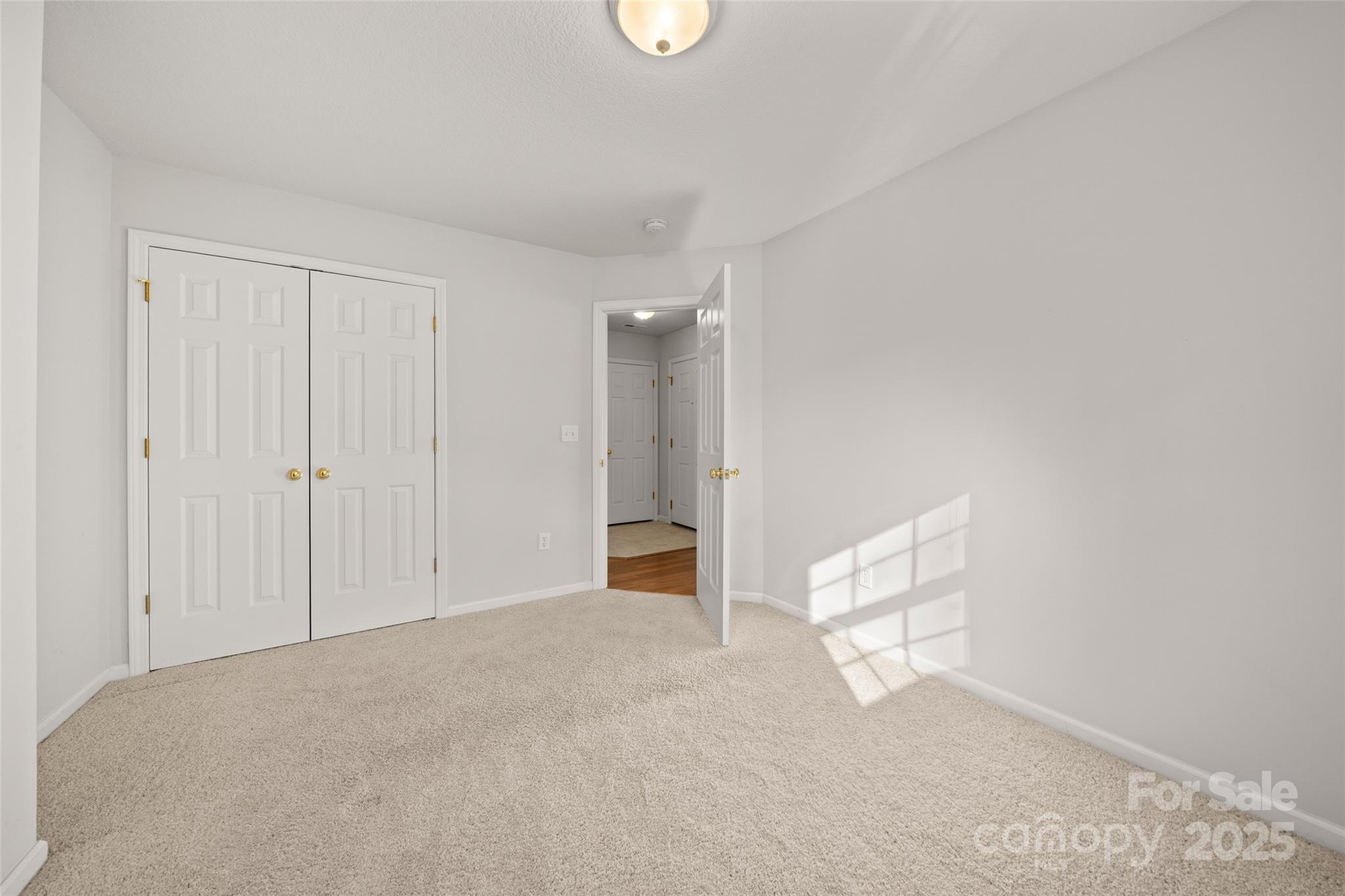 270 Farington Circle Fletcher, NC 28732 - Photo 17 of 29 a view of an empty room with window and hardwood floor