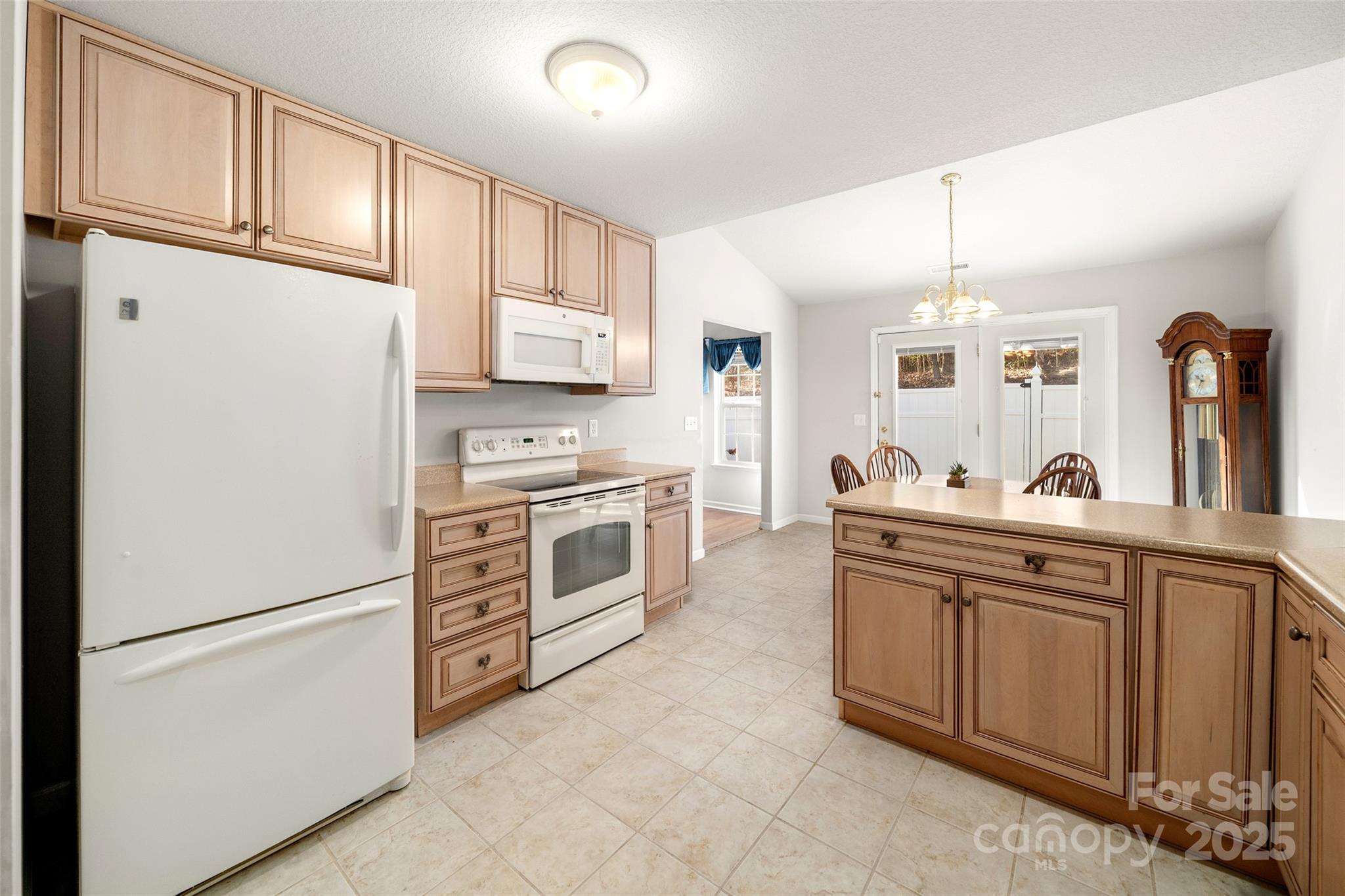 270 Farington Circle Fletcher, NC 28732 - Photo 25 of 29 a kitchen with stainless steel appliances granite countertop a refrigerator sink and cabinets