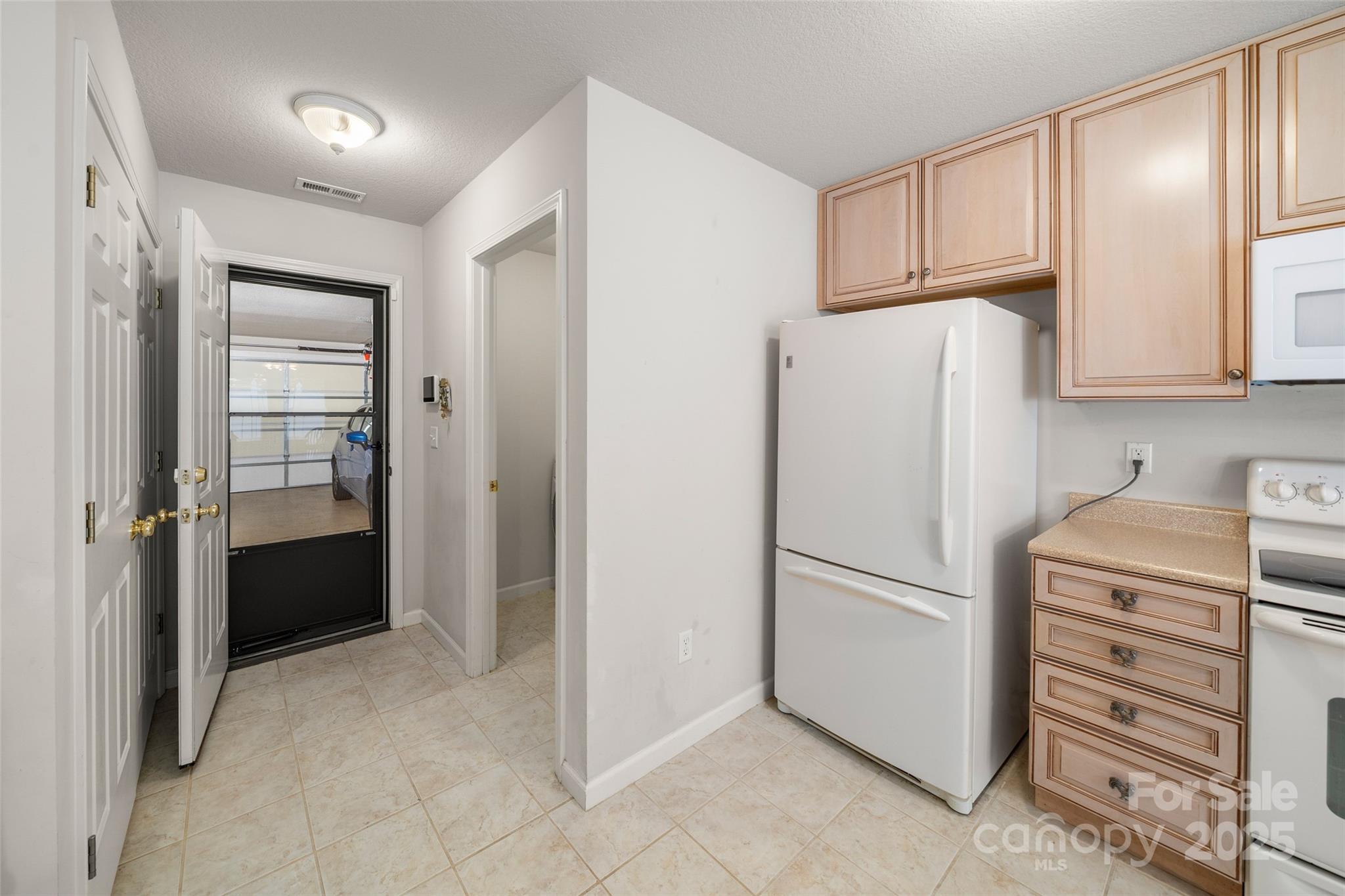 270 Farington Circle Fletcher, NC 28732 - Photo 28 of 29 a kitchen with a refrigerator and a stove