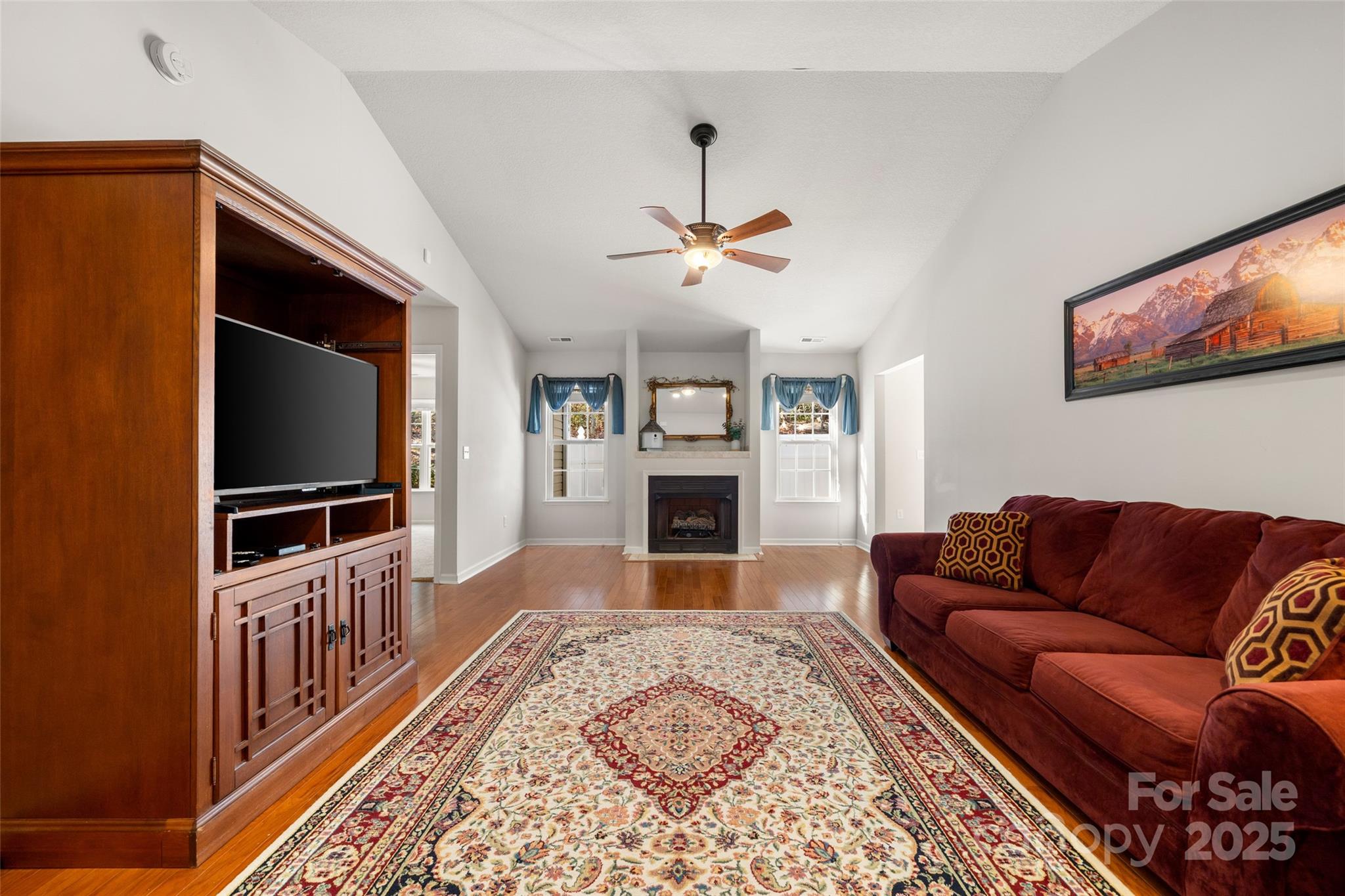 270 Farington Circle Fletcher, NC 28732 - Photo 6 of 29 a living room with furniture a flat screen tv and a fireplace