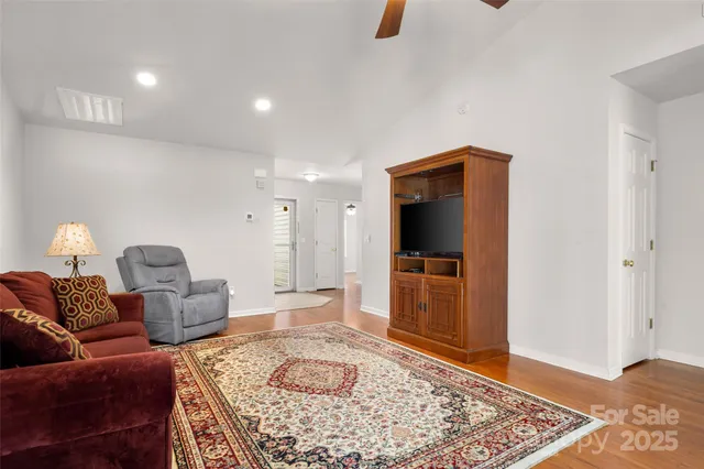 a living room with furniture and a rug