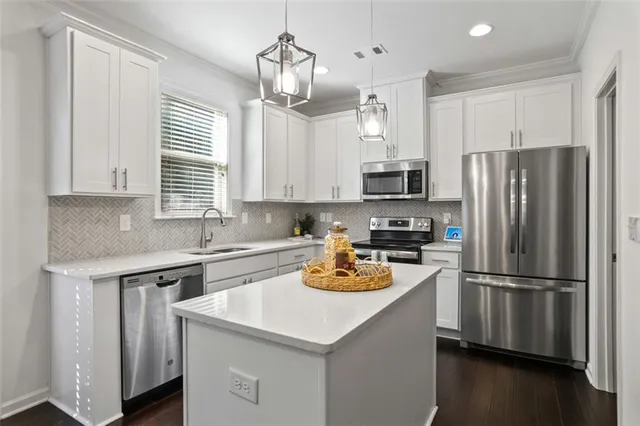 a kitchen with a stove oven and refrigerator