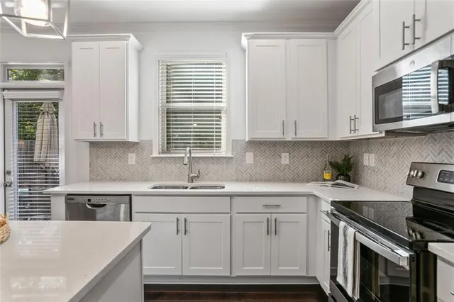 a kitchen with a sink and cabinets