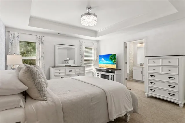 a bedroom with a bed and a mirror