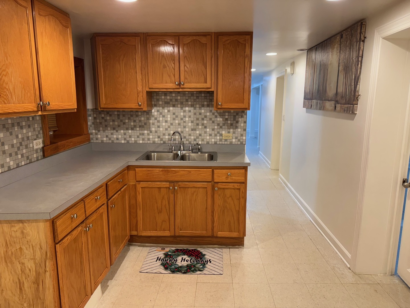 2434 West Pershing Road Chicago, IL 60632 - Photo 5 of 12 a bathroom with a sink and a mirror