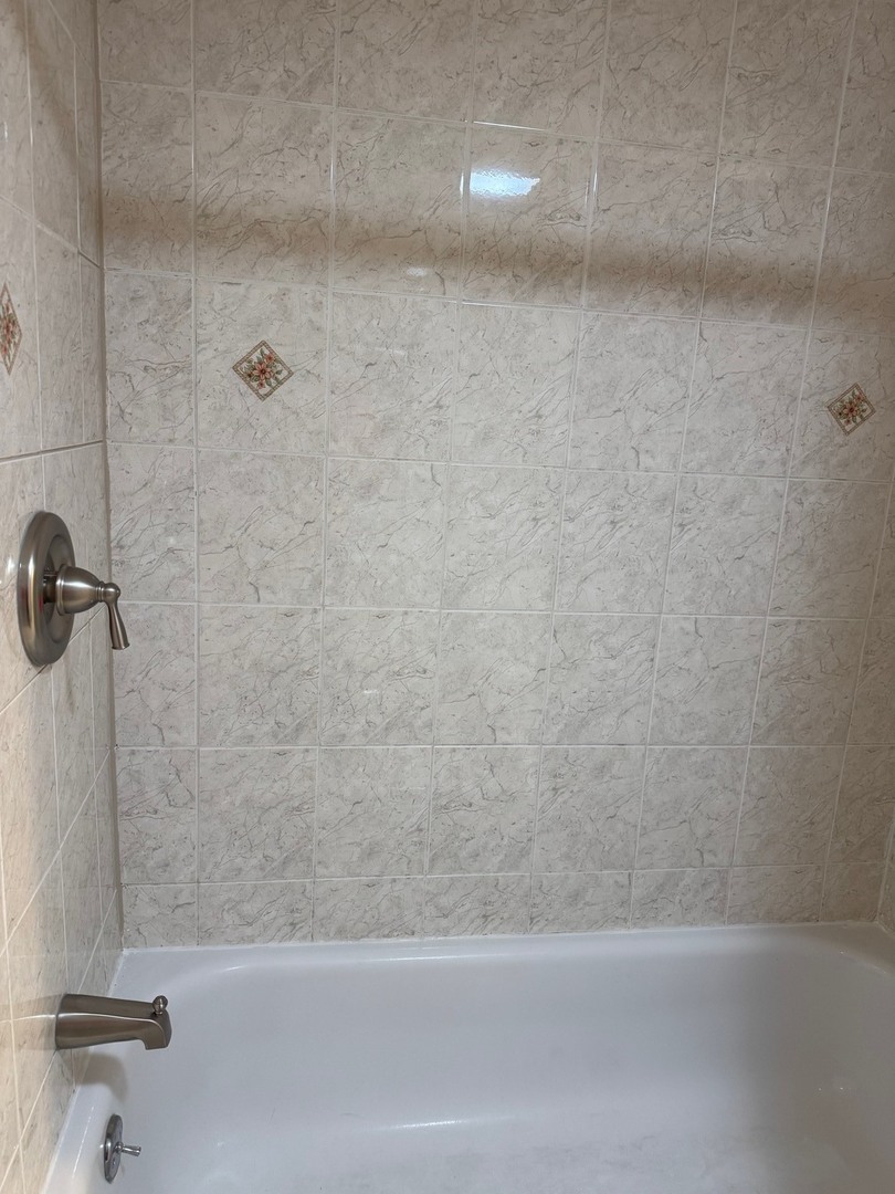 2434 West Pershing Road Chicago, IL 60632 - Photo 9 of 12 a bathroom with a bathtub