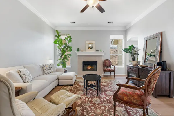 a living room with furniture and a fireplace