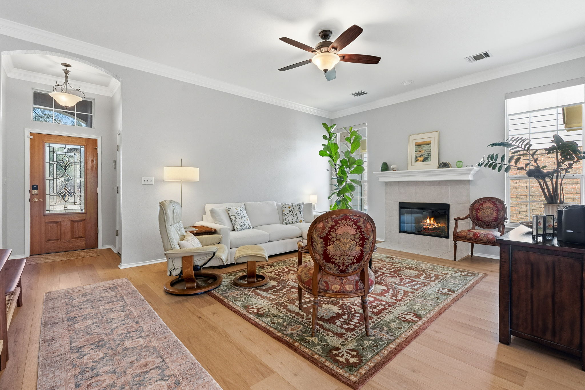 2306 Clover Ridge Drive Cedar Park, TX 78613 - Photo 7 of 29 a living room with furniture a fireplace and a table