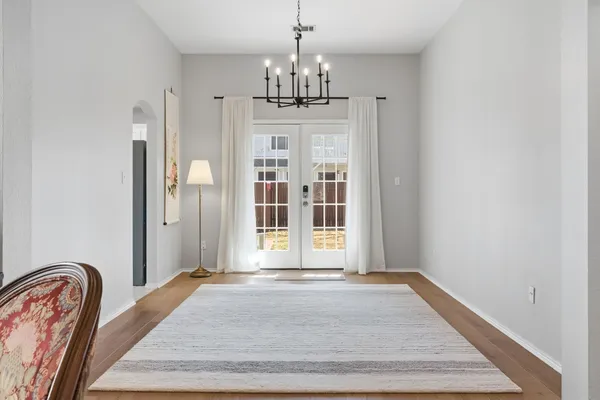 a view of a livingroom with a furniture window and wooden floor