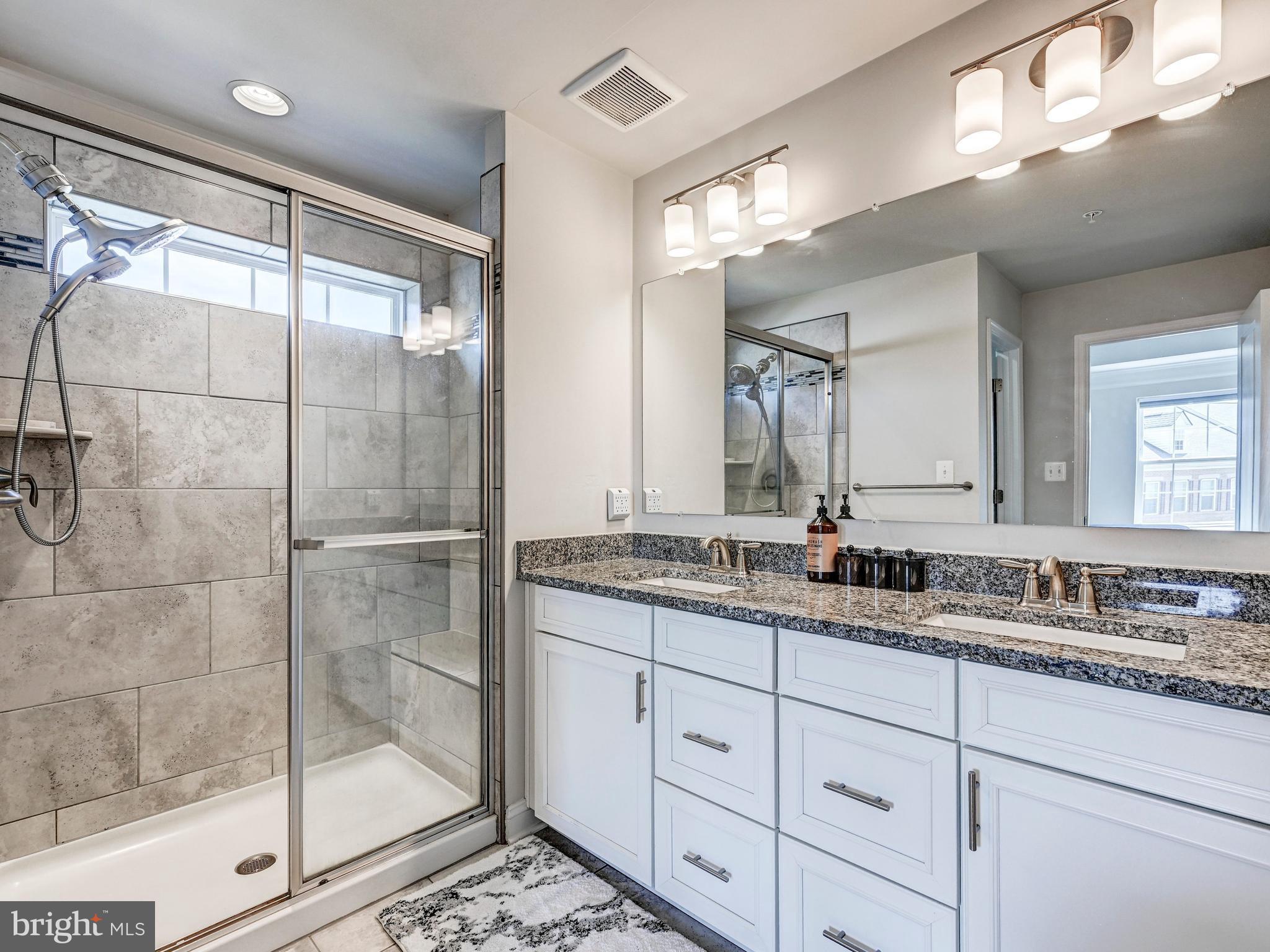 5000 John Buck Avenue Perry Hall, MD 21128 - Photo 28 of 41 a bathroom with a granite countertop sink mirror and shower