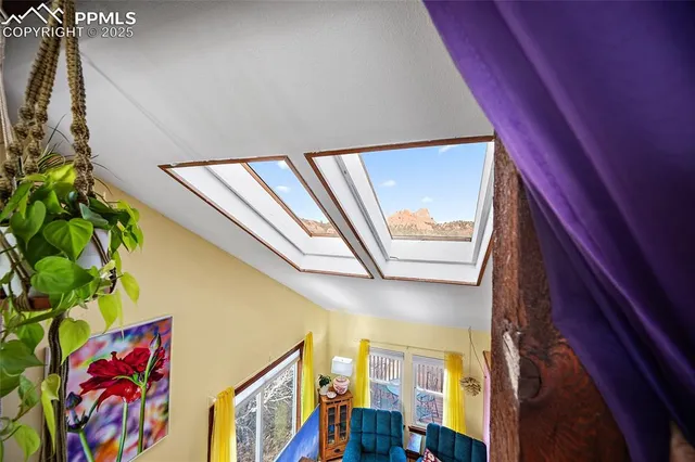 a bed sitting in a room next to a lamp