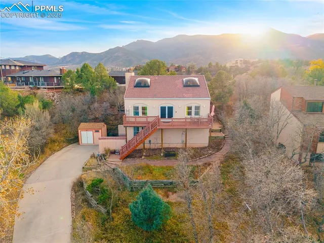 an aerial view of a house with a garden