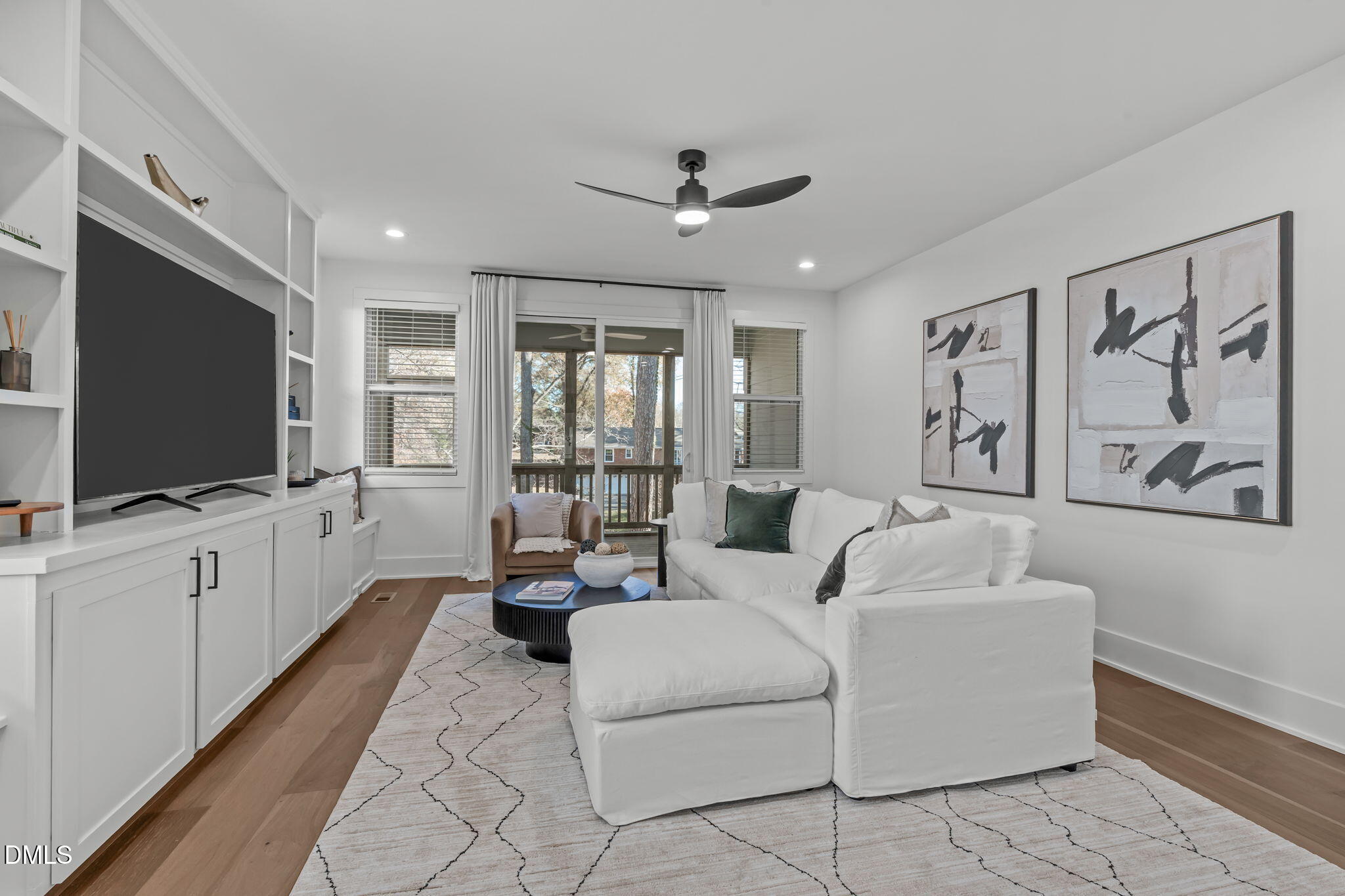 637 Conover Road, Unit A Durham, NC 27703 - Photo 16 of 51 a living room with furniture and a flat screen tv