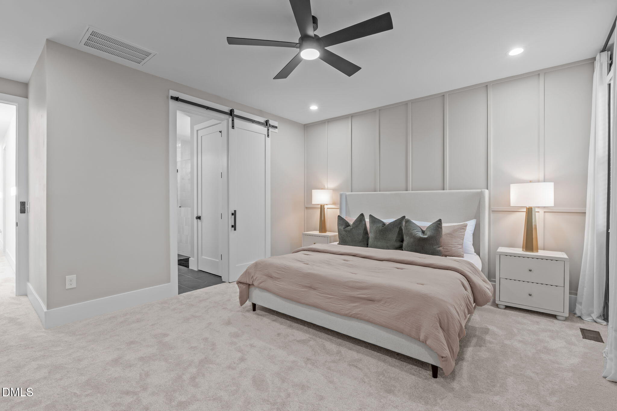 637 Conover Road, Unit A Durham, NC 27703 - Photo 23 of 51 a spacious bedroom with a bed and a ceiling fan