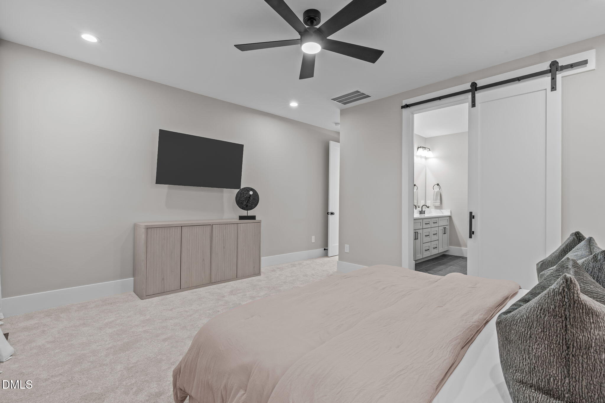 637 Conover Road, Unit A Durham, NC 27703 - Photo 24 of 51 a bedroom with a bed and a flat screen tv