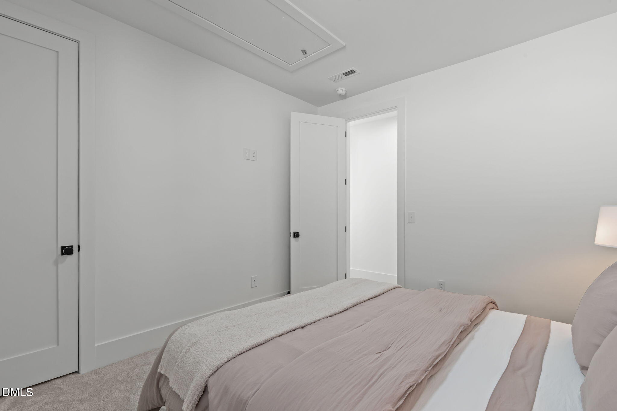 637 Conover Road, Unit A Durham, NC 27703 - Photo 31 of 51 a bedroom with a bed and a window