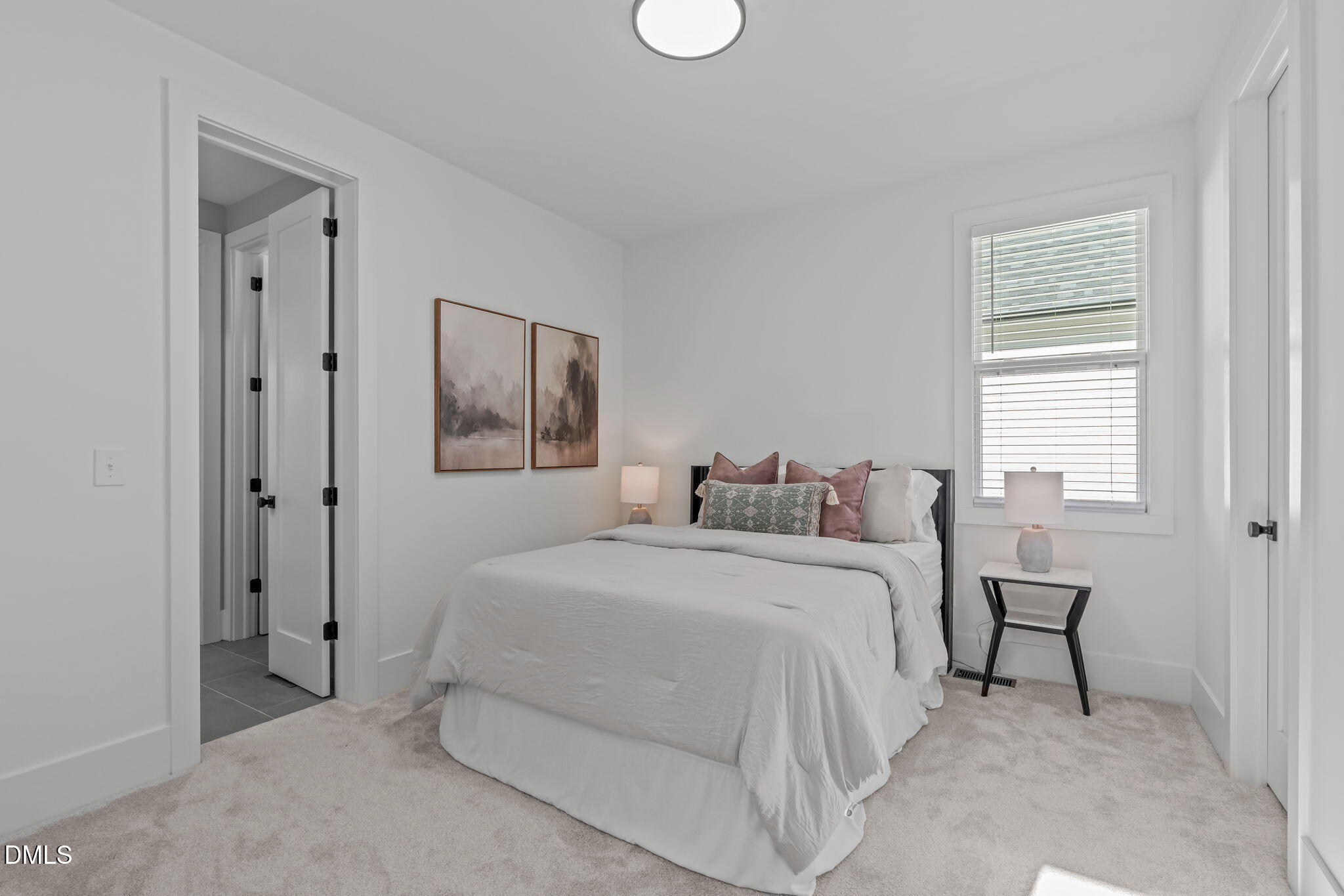 637 Conover Road, Unit A Durham, NC 27703 - Photo 33 of 51 a bedroom with a bed and a window