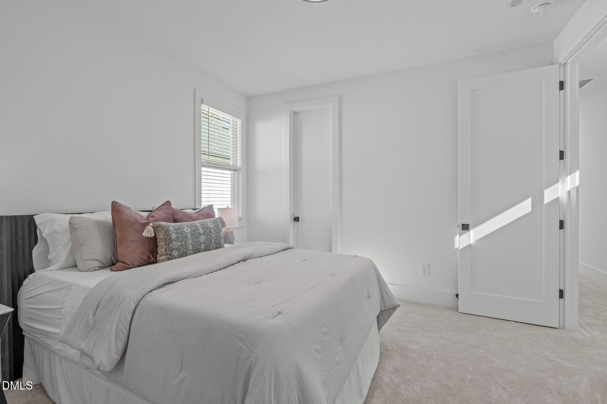 637 Conover Road, Unit A Durham, NC 27703 - Photo 35 of 51 a bed room with a bed and a window