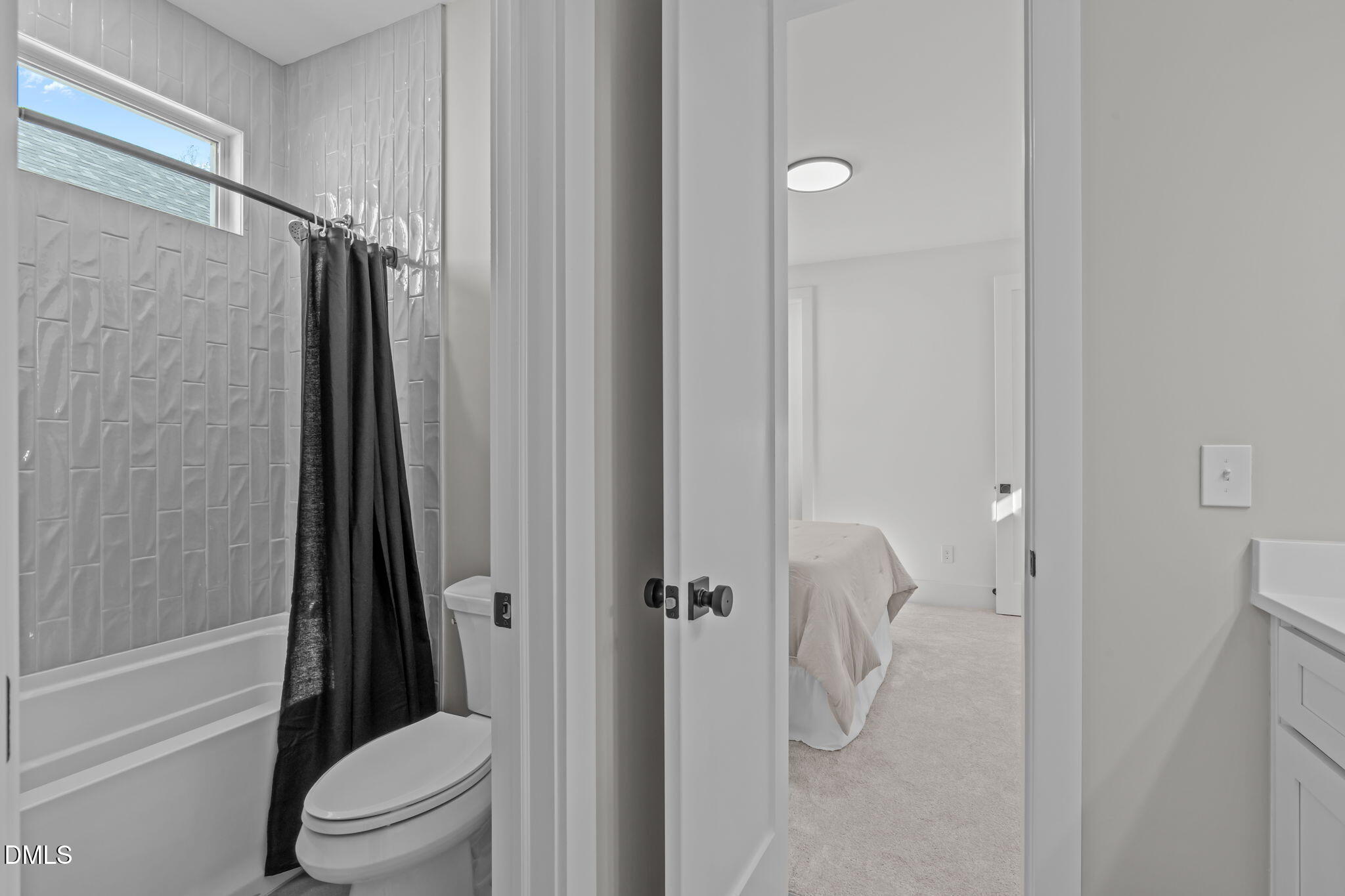 637 Conover Road, Unit A Durham, NC 27703 - Photo 38 of 51 a bathroom with a shower toilet and sink