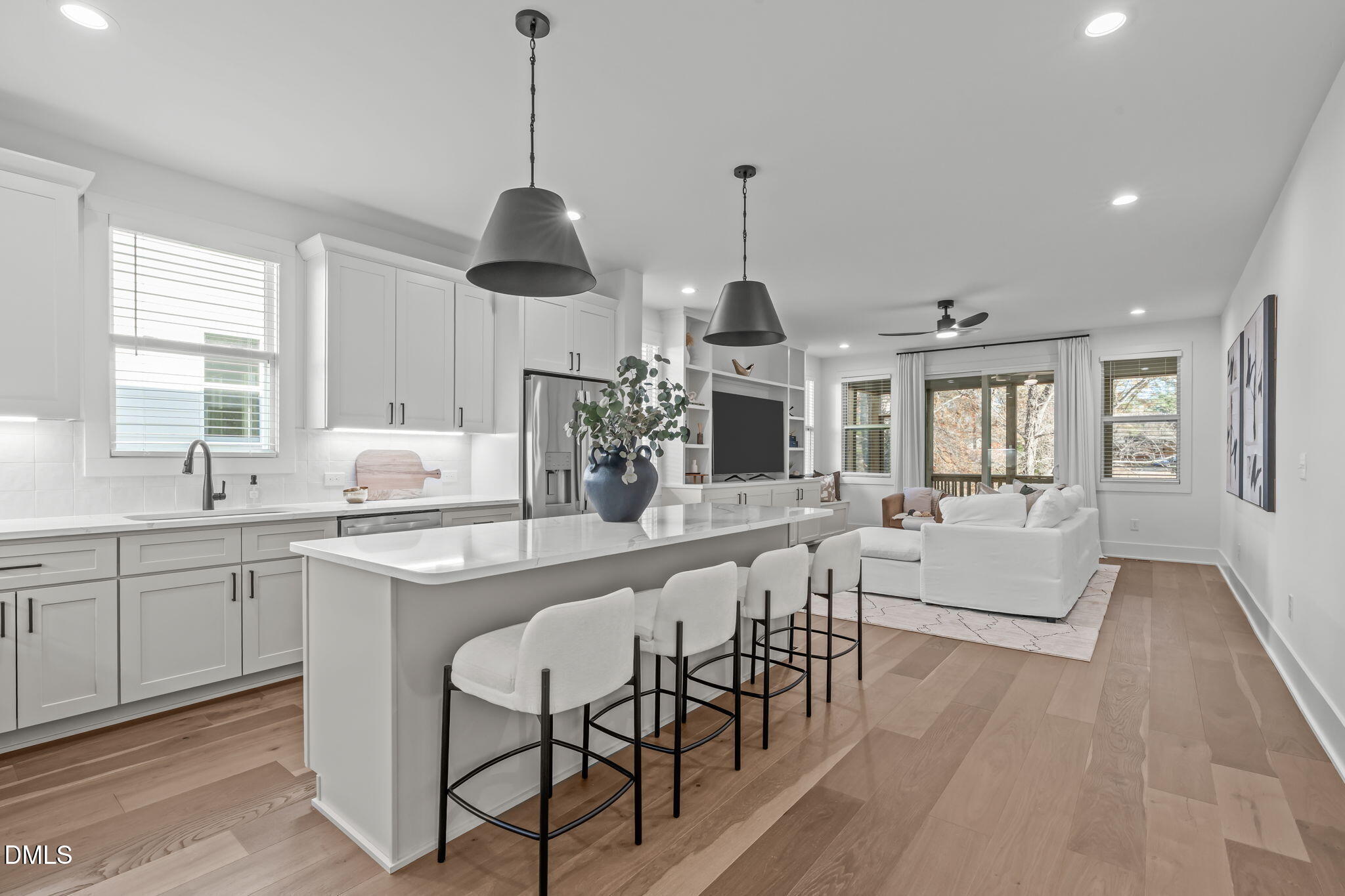 637 Conover Road, Unit A Durham, NC 27703 - Photo 9 of 51 a large kitchen with cabinets a sink a window and stainless steel appliances
